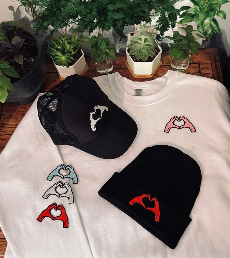 Heart hands trucker hat • baseball cap • customizable • embroidered patch on hat